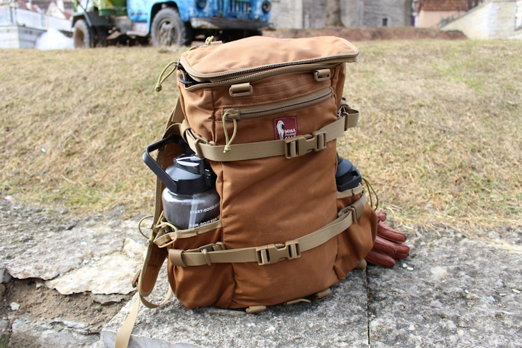 Complete hiking gear flatlay showing organized equipment layout