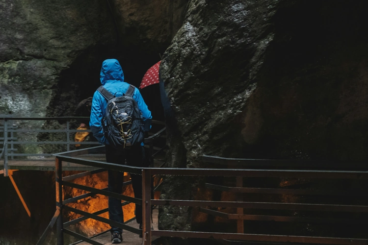 Hiker wearing rain jacket in wet weather conditions